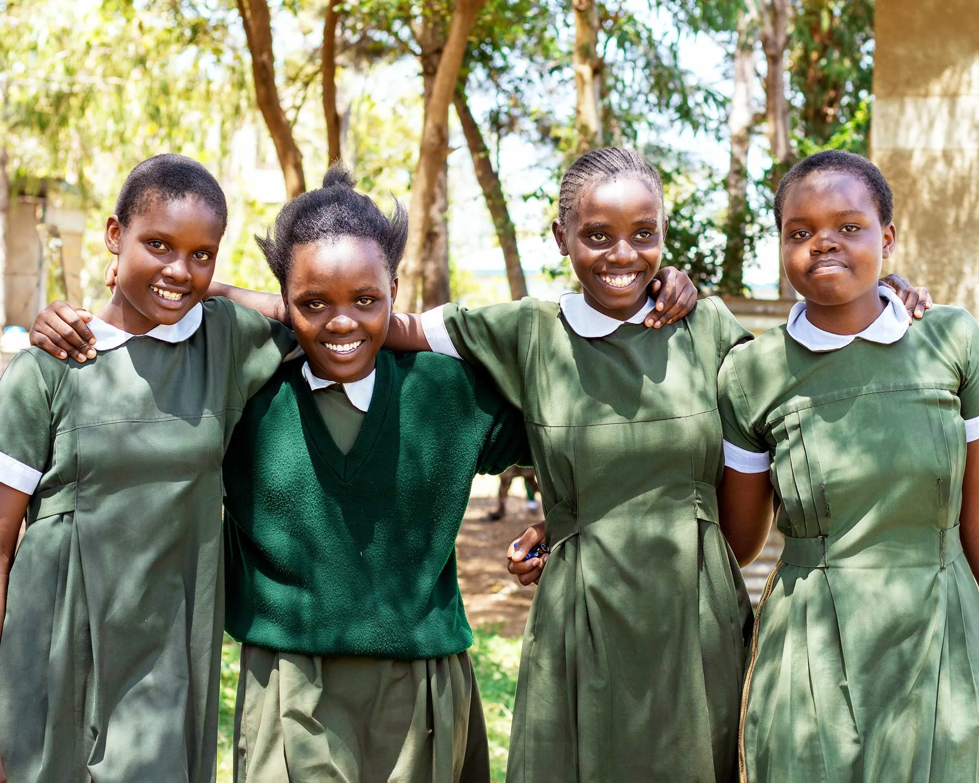 Tumaini graduates celebrating at sunset in Kenya